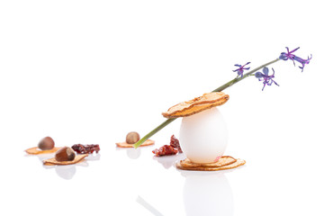 Vegetarian breakfast. Dried sliced pear with egg, sun-dried tomatoes and hazelnuts