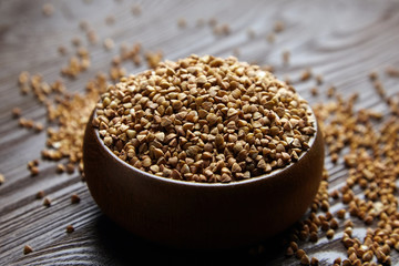 Buckwheat groats (hulled seeds) in wooden bowl