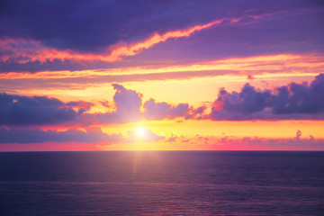 Naklejka na ściany i meble scenic dramatic ocean orange tropical landscape, golden sunset or sunrise at sea