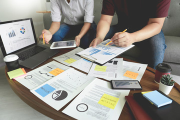 Business people meeting at office writing memos on sticky notes. planning strategy and brainstorming, colleagues thinking concept.