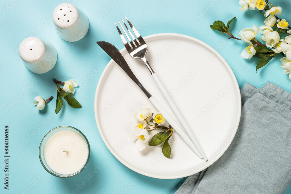 Wall mural spring table setting with flower top view.