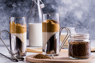Dalgona coffee with a cool fluffy whipped foam in glasses.