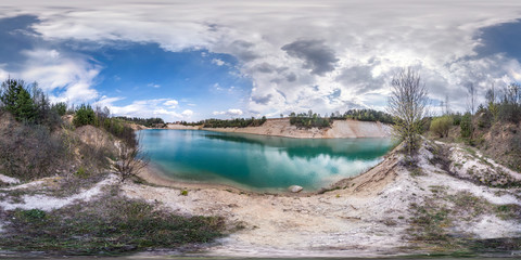 full seamless spherical hdri panorama 360 degrees angle view on limestone coast of huge green lake for sand extraction old mining with beautiful clouds in equirectangular projection, VR content