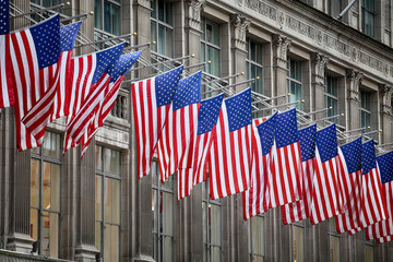 American flags on a classical building on Fifth Avenue (5th Avenue), Manhattan, New York