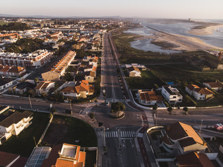 The marginal riverside, along the mouth of the Cavado River at sunset in Esposende, Portugal. The two sides of Restinga de Ofir. One facing the ocean, the other the estuary of C&aacute;vado River.