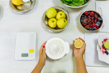 Cooking healthy and tasty fresh. Extracting fruit juice from a juicer