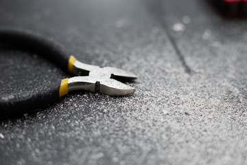 Close-up of a wire cutter a professional electrician installer tool.