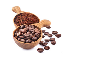 Coffee beans and ground coffee in wooden spoon on white background. Coffee   beans isolated.
