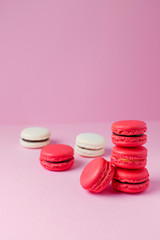 Beautiful colourful desserts. french macaroons on a pink background