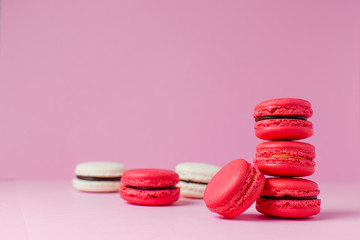 Beautiful colourful desserts. french macaroons on a pink background