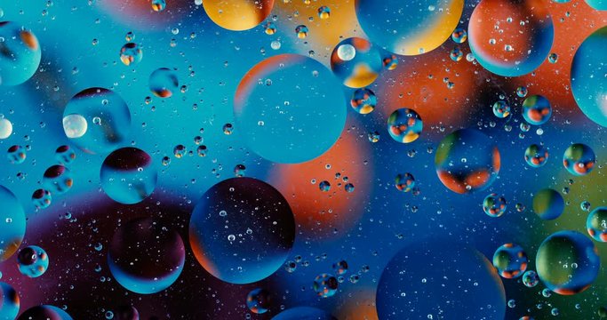 Movement oxygen bubbles in a liquid. Beautiful structure of water in macro a natural background	