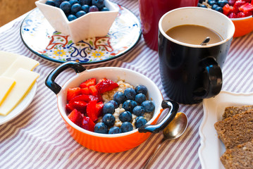 Healthy breakfast with oatmeal with strawberries and blueberries. Food lifestyle.