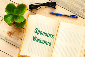 Fototapeta premium Conceptual hand writing showing Sponsors Welcome