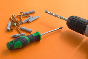 DIY tool set consisting of screws, dowels, screwdriver and drill