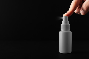 Bottle of antiseptic spraying. Antibacterial spray for hands. Plastic bottle of sanitizer with clear body.