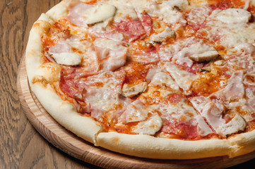 cooked pizza with cheese close-up
