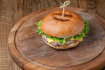 burger with latch on a wooden tray