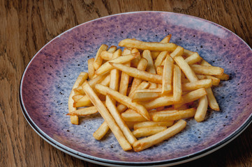 french fries in a purple plate