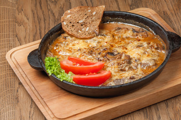 baked meat stew with vegetables in a pan