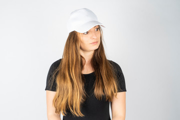 women with plain black t-shirt and hat or cap on white background