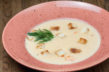 salmon cream soup with slices of bread