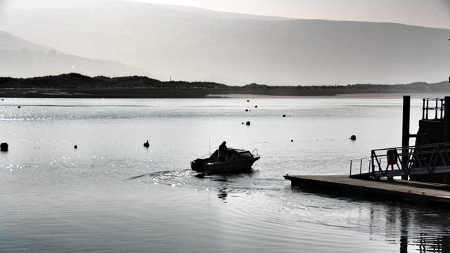 Motorboat Departing From Jetty On Cam Lake