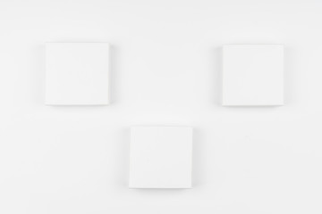 plain white buttons or boxes on wall