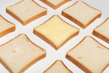 slices of wheaten bread spreaded with butter. pattern