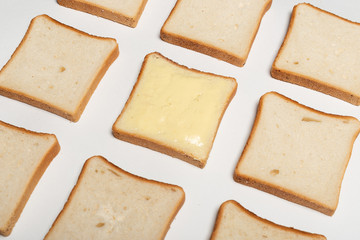 slices of wheaten bread spreaded with butter. pattern