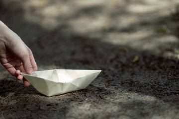 paper boat female hand
