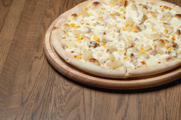 cooked pizza with cheese close-up
