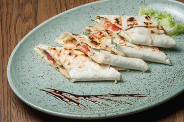 chopped pita bread with cheese and tomatoes