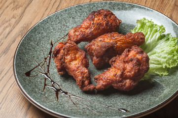 chicken wings with salad in a plate
