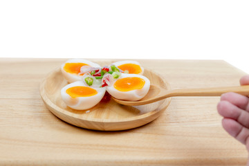 Eggs Salad on dish wooden isolated white background. Thai food.