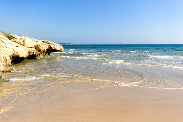 Fototapeta na wymiar Mediterranean beach at sunny day. Clear sky.