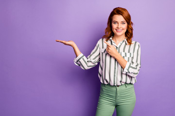 Portrait of confident cool businesswoman hold hand promo ads point index finger suggest select pick...