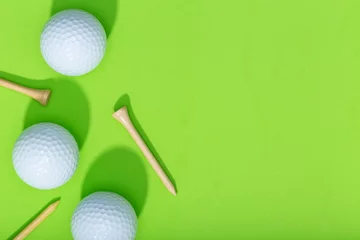 Poster Golf background. Group of golf balls and tee on green background. Top view copy space © Formatoriginal