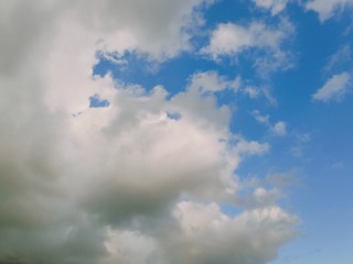 black and white clouds with blue sky