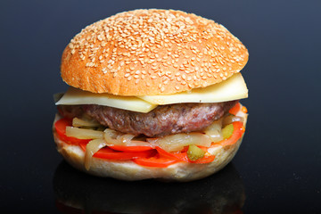 Homemade cheese burger Black background..