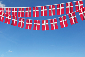 Denmark flag festive bunting hanging against a blue sky. 3D Render