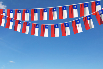 Chile flag festive bunting hanging against a blue sky. 3D Render