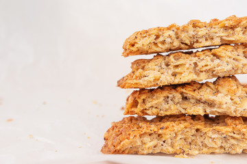 Homemade fresh appetizing oatmeal cookies close-up. The concept of healthy breakfast, homemade food. Light background.