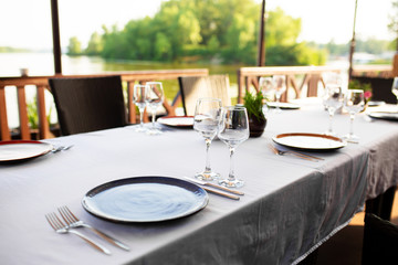 Stylish table setting in an open-air restaurant.