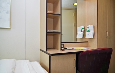 Desk inside cabin or stateroom on cruiseship or cruise ship liner