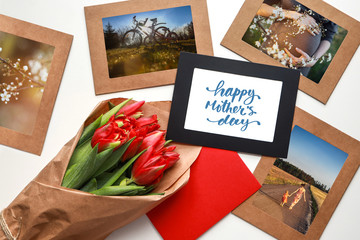 Red tulips bouquet among picture frames with photos about motherhood and Happy Mother's Day calligraphy greeting