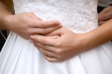 Obraz na płótnie Canvas Hands of the bride close up