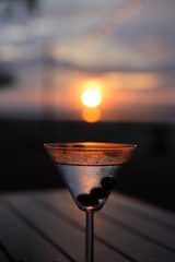 Martini on beach at sunset