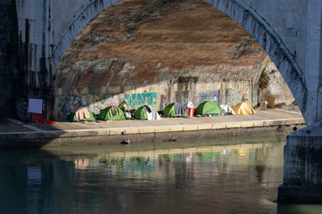 Tents near the cancal in Rome Italy showing the poverty of the city where the homeless people rest