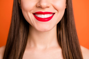 Closeup cropped photo of attractive lady bright red pomade amazing celebrity smile half face dentistry concept isolated vibrant orange color background