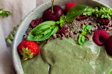 Healthy green smoothie bowl with fruits